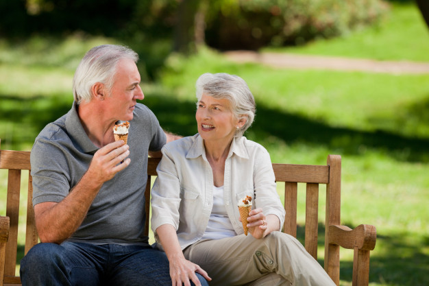 senior-couple-eating-ice-cream-bench_13339-260054.jpg